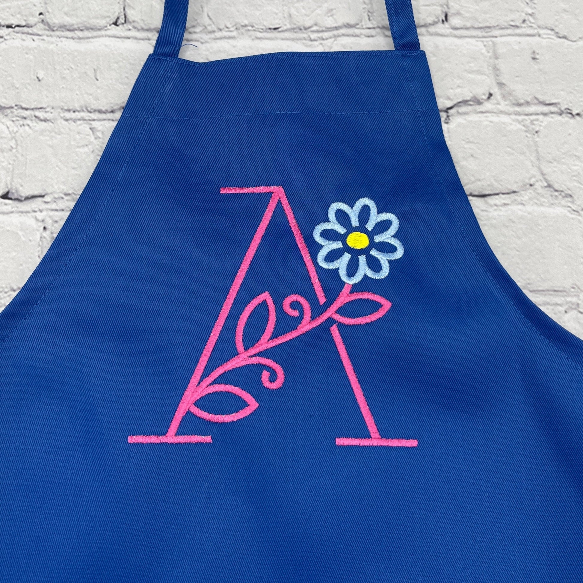 Girls embroidered apron with large initial and flower royal blue apron