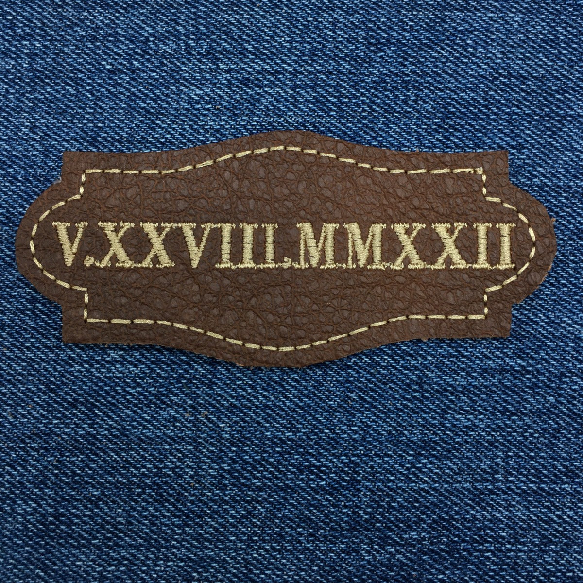 leather roman numeral date patch on denim