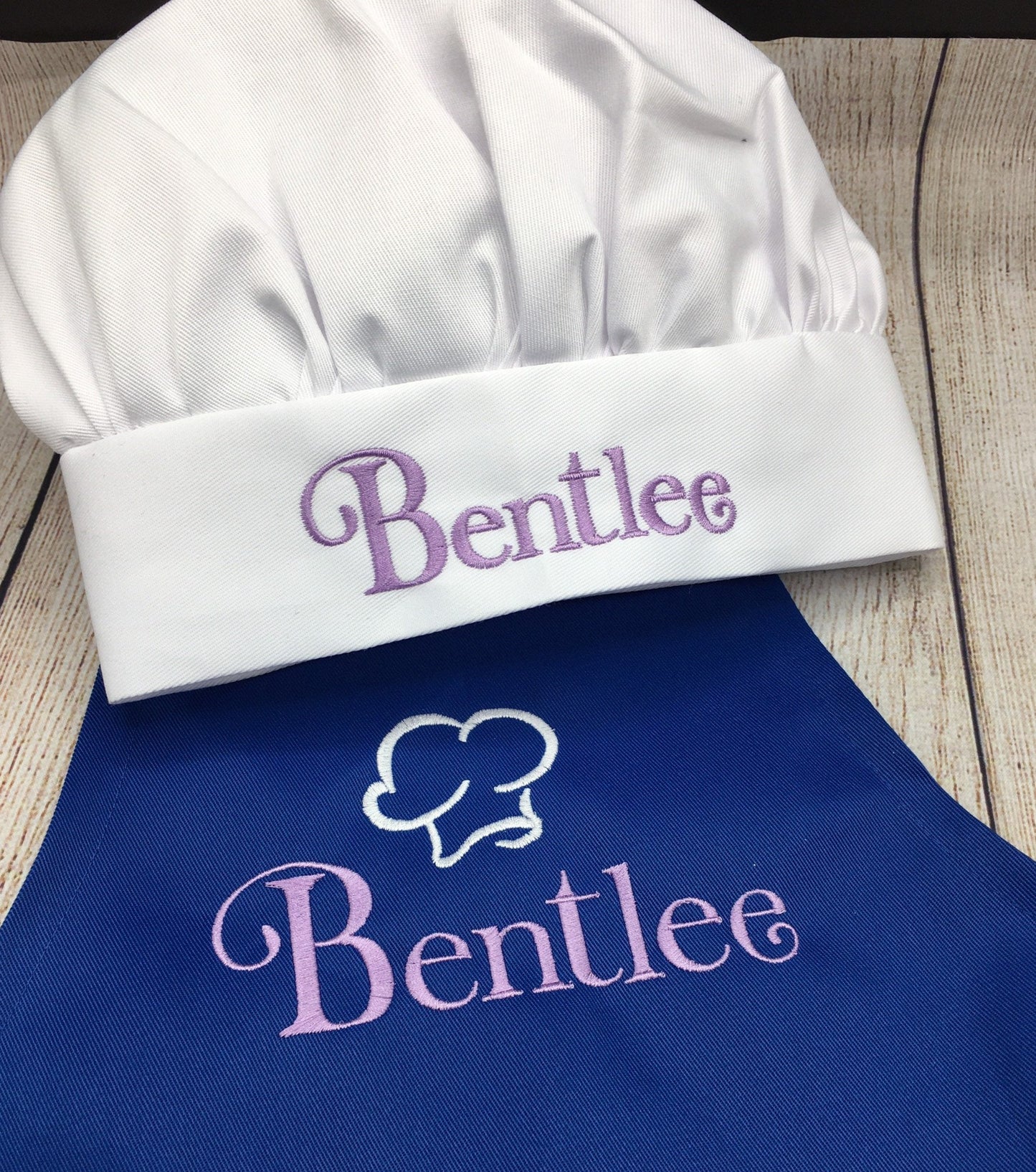 Child's royal blue apron and white chefs hat with embroidered name