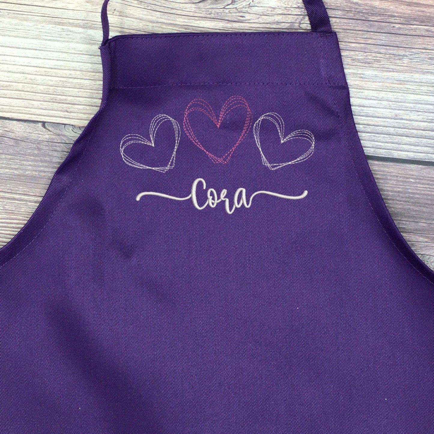 Purple embroidered apron personalized with name