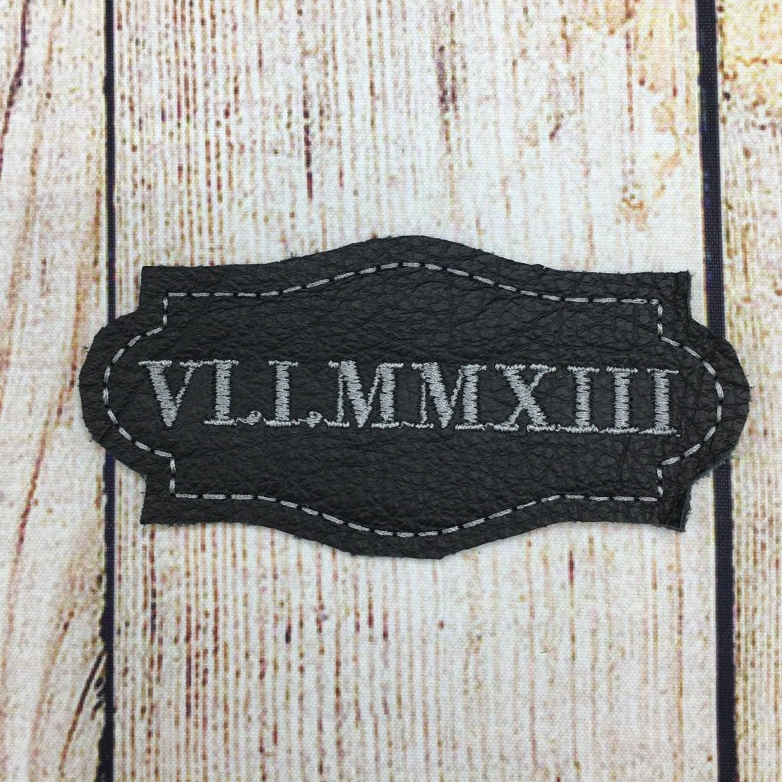 Roman numerals date patch black leather