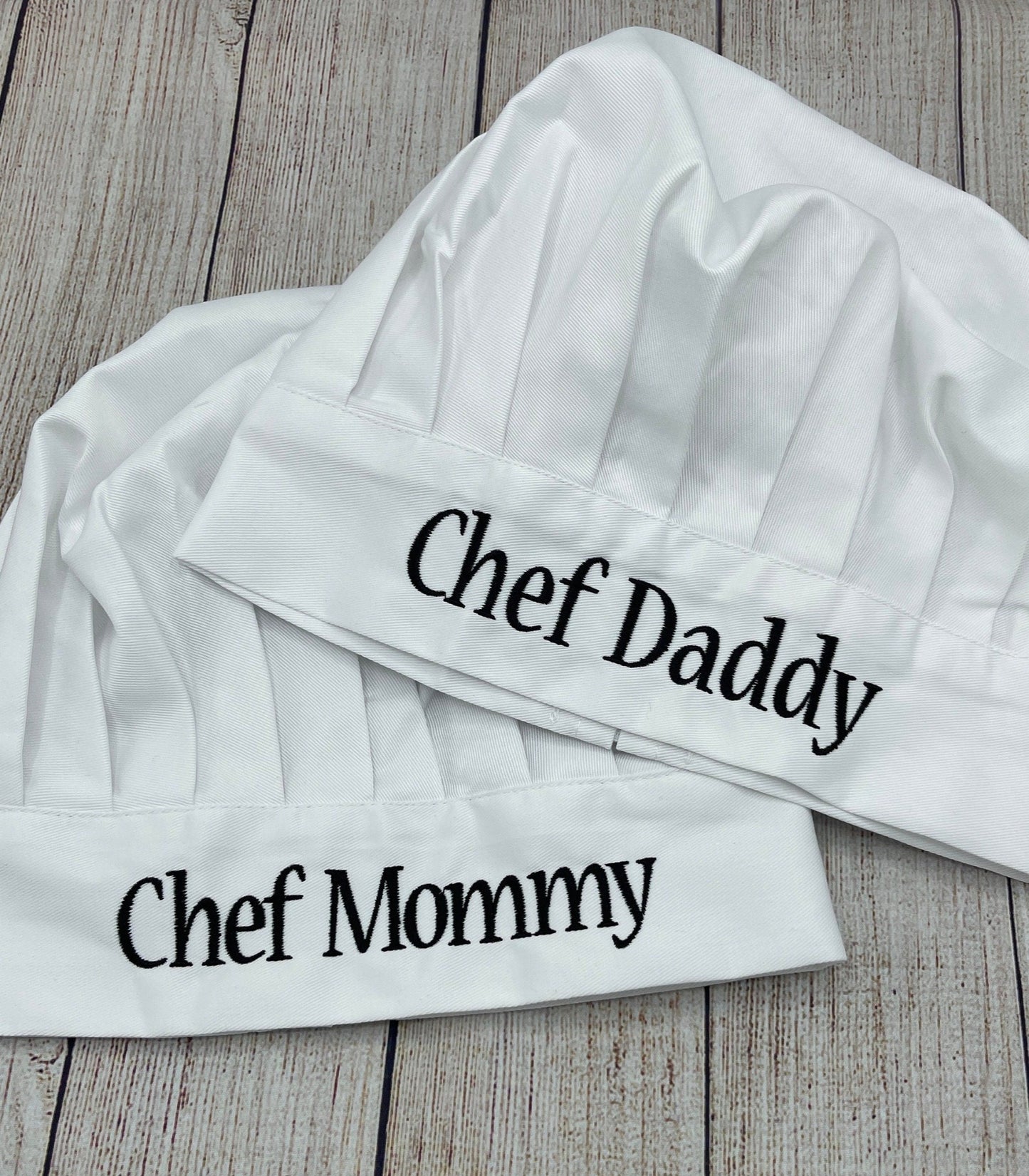 White Chef hats that say chef mommy and chef daddy